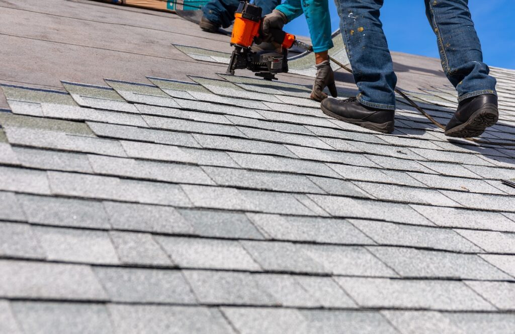 Asphalt shingle installation with nail gun
