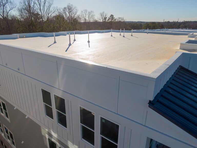 Drone photo of a newly installed flat roof system with waterproof coating
