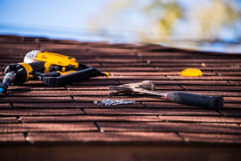 Roofing tools sitting on an asphalt roof