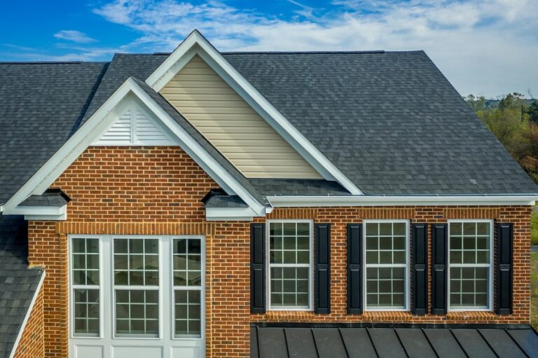 Brick home with asphalt shingle roof