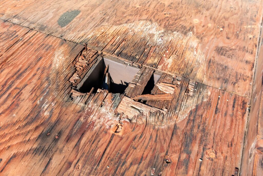 large hole damaged on roof sheathing