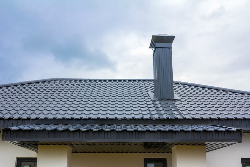 roof of a new private house against the background of a cloudy sky on a summer day