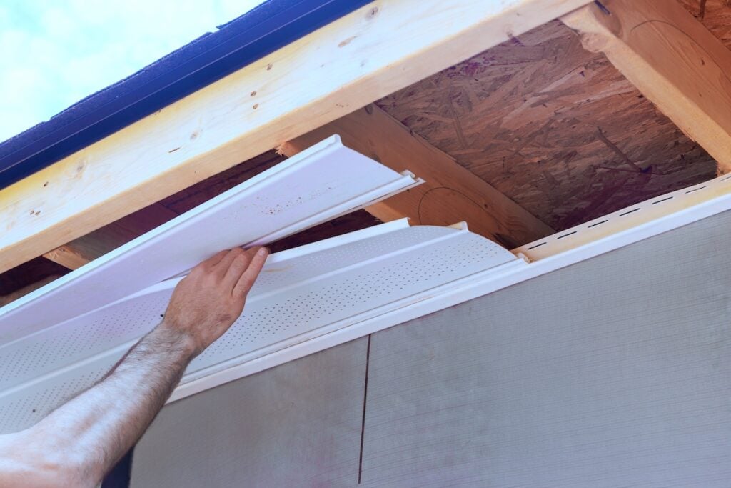 Installation of upvc soffit boards at roof corner of home