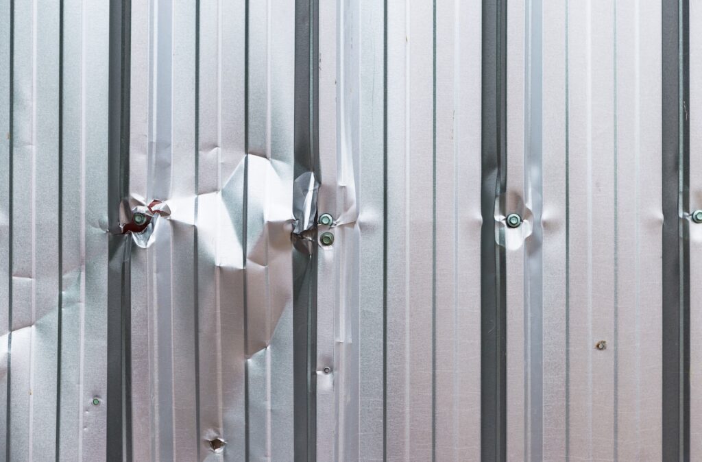 Damaged metal sheet wall background, construction concept background