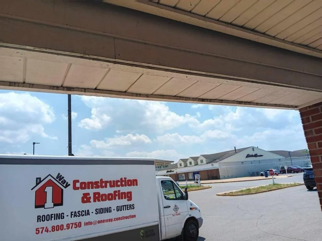 Oneway construction and roofing white truck