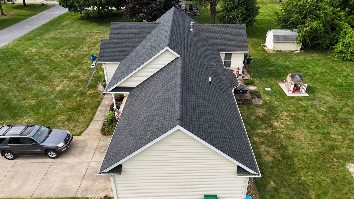 A house with a newly installed shingle roof