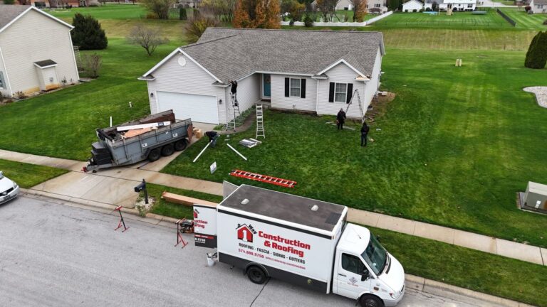 One Way Roofing van in front of a house