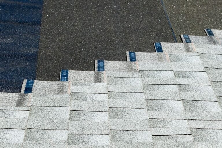 asphalt shingles being installed on top of roof underlayment