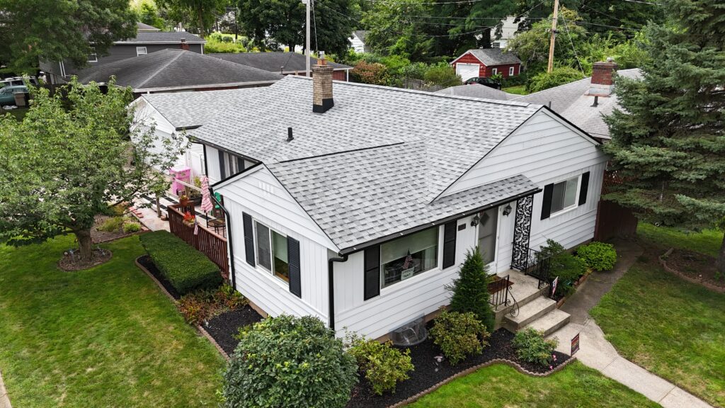mold on roof shingles small white house