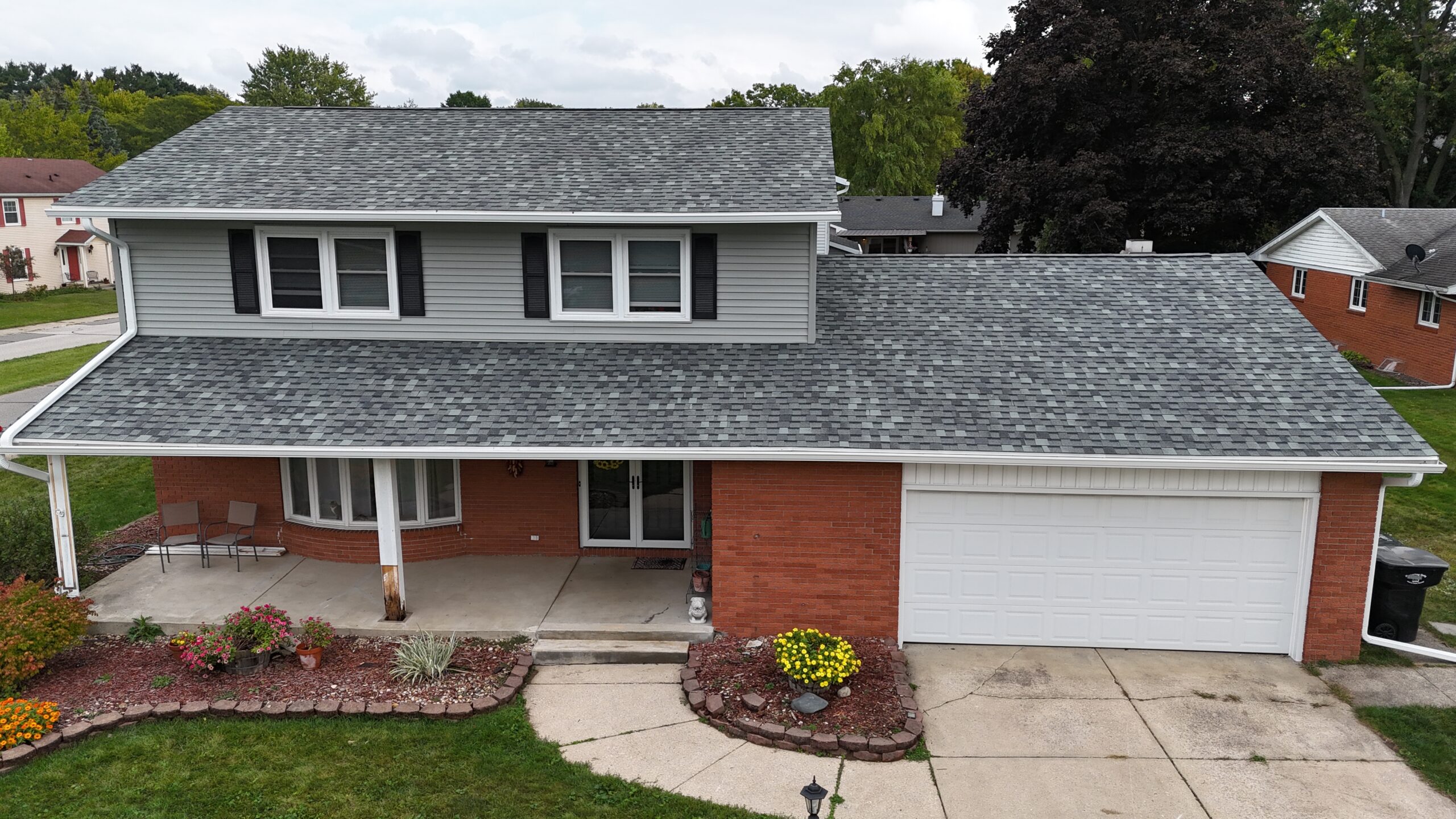 class 4 impact resistant shingles grey shingles roof orange wall
