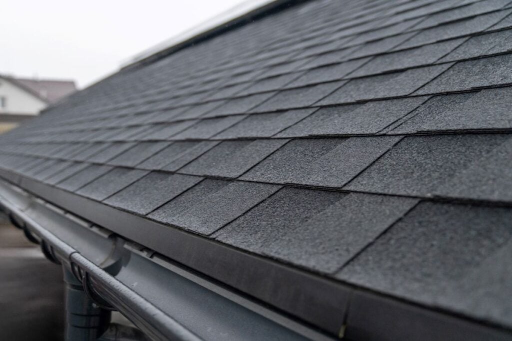 half round copper gutters gutter and shingles roof closeup