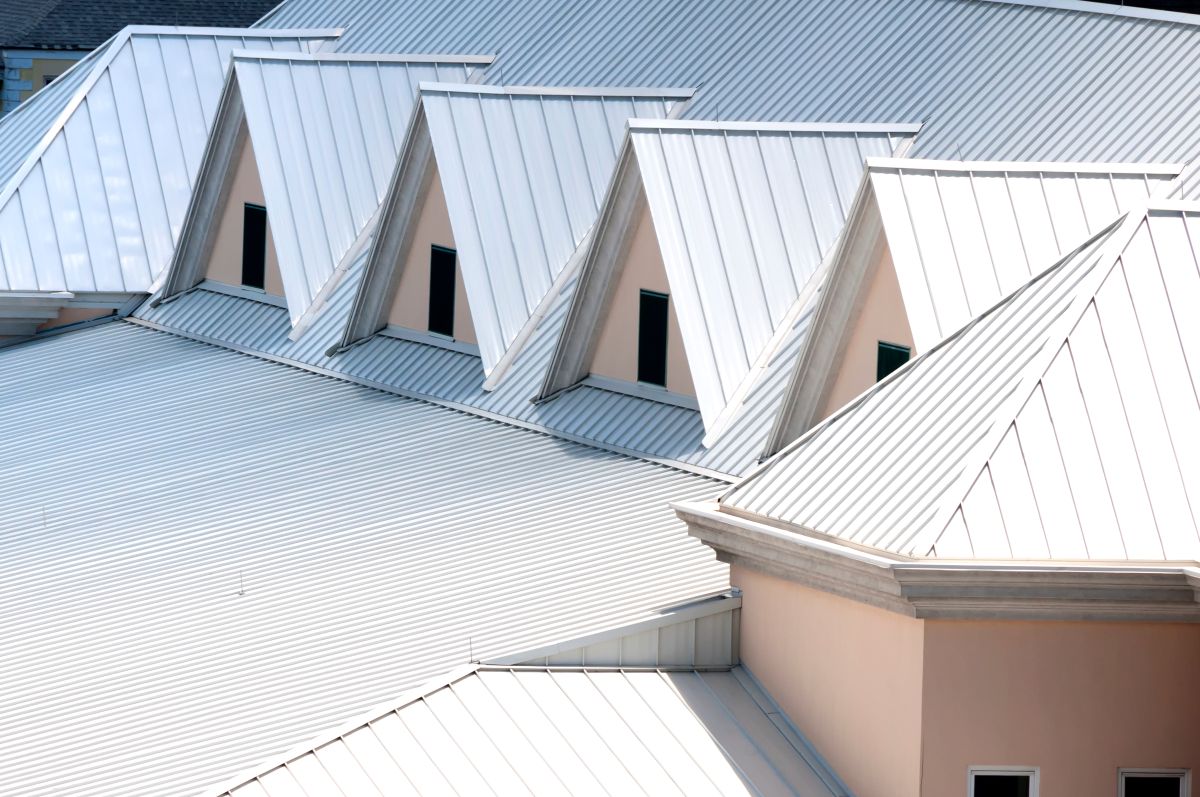 standing seam vs exposed fastener white big commercial roof