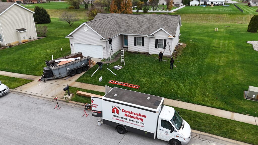 truck parked outside small house