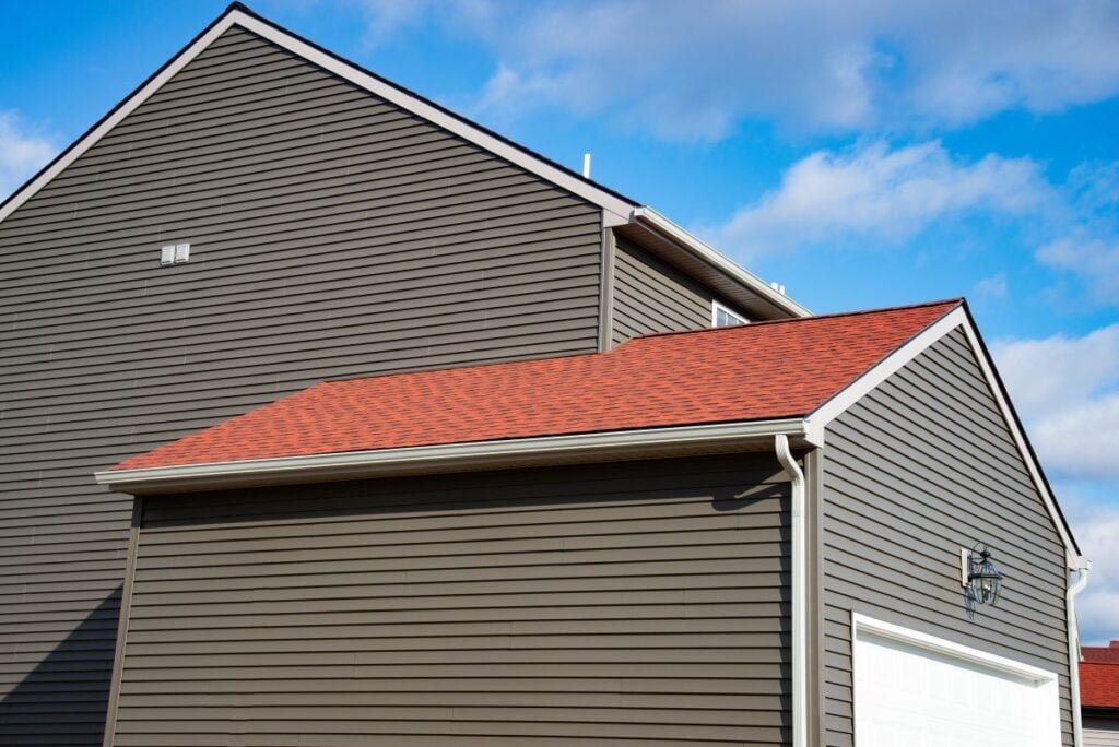 orange roof vinyl siding vs fiber cement