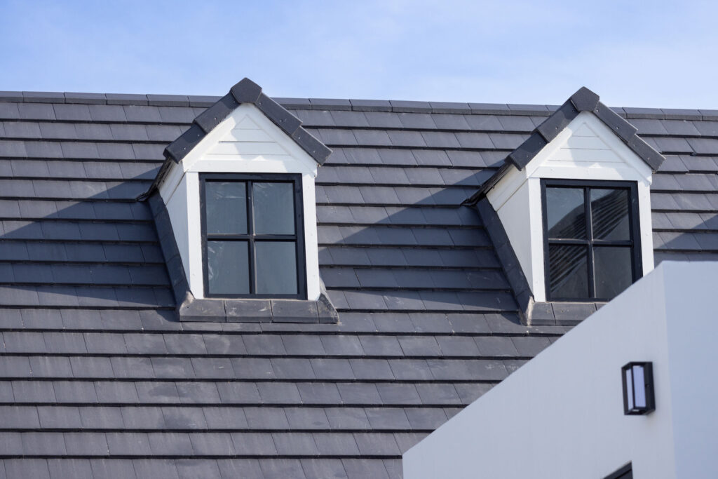 house with slate roof and white siding