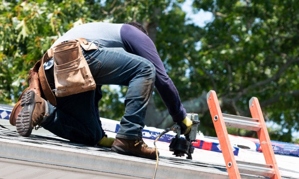 roof overlay guy replacing shingles